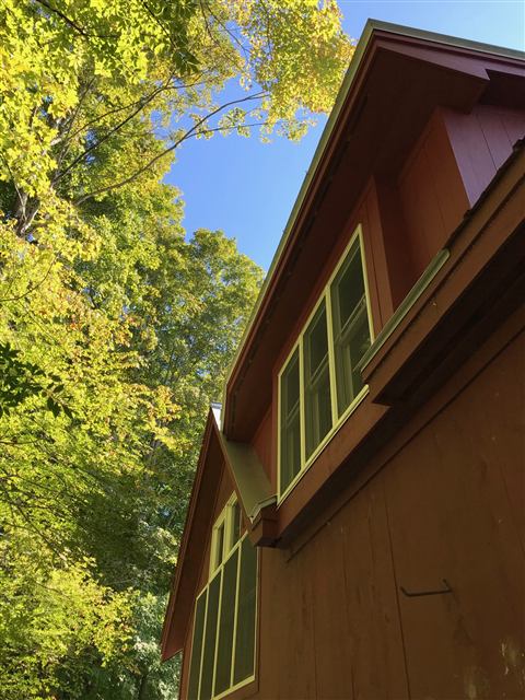 Dormer windows on a wood-sided addition