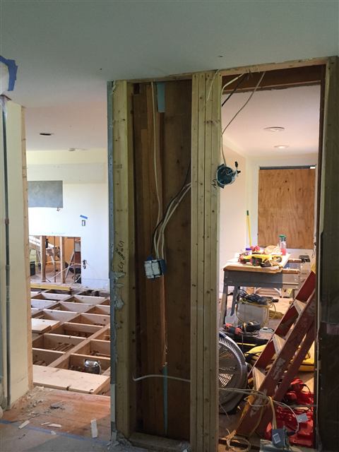 Framed opening with new wiring during construction