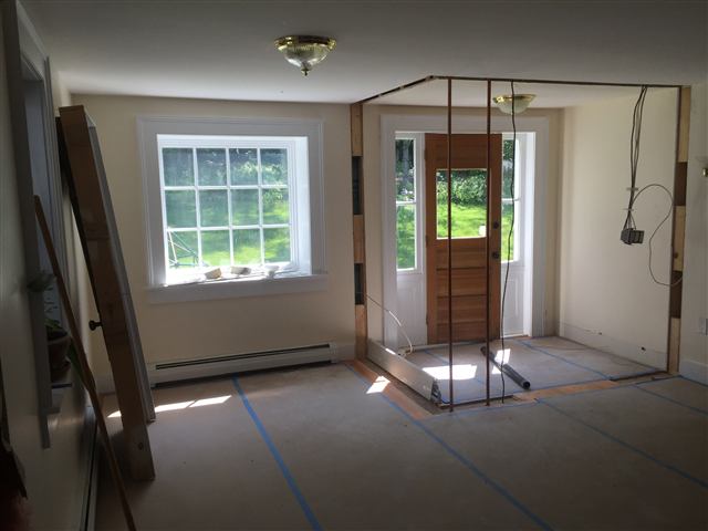 Framed opening and taped floor at the start of a remodel