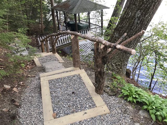 Gravel and timber steps with a rustic railing