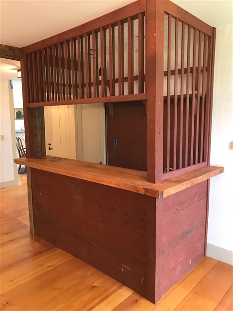 Reclaimed-wood bar with a spindle divider